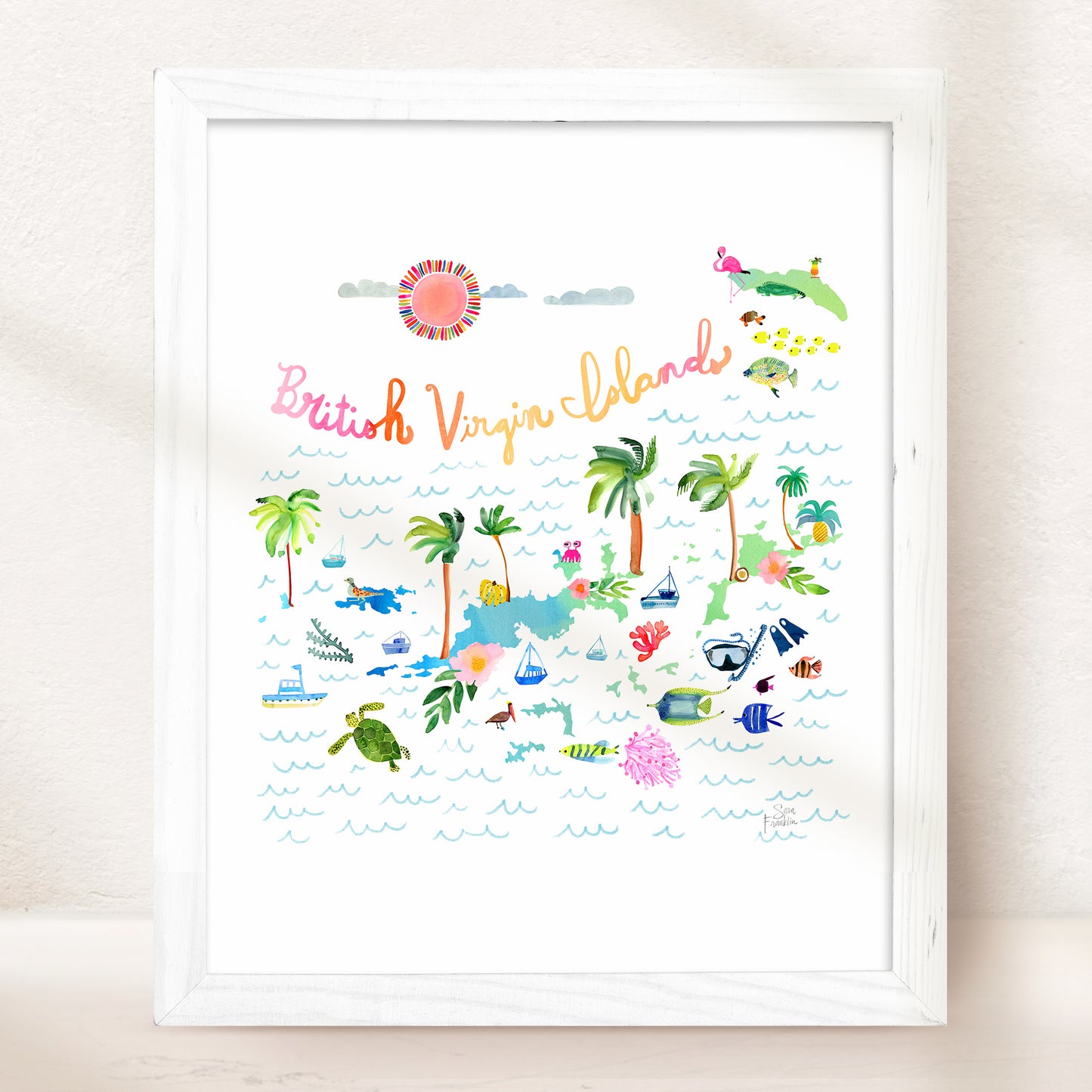 a white framed picture of a beach scene