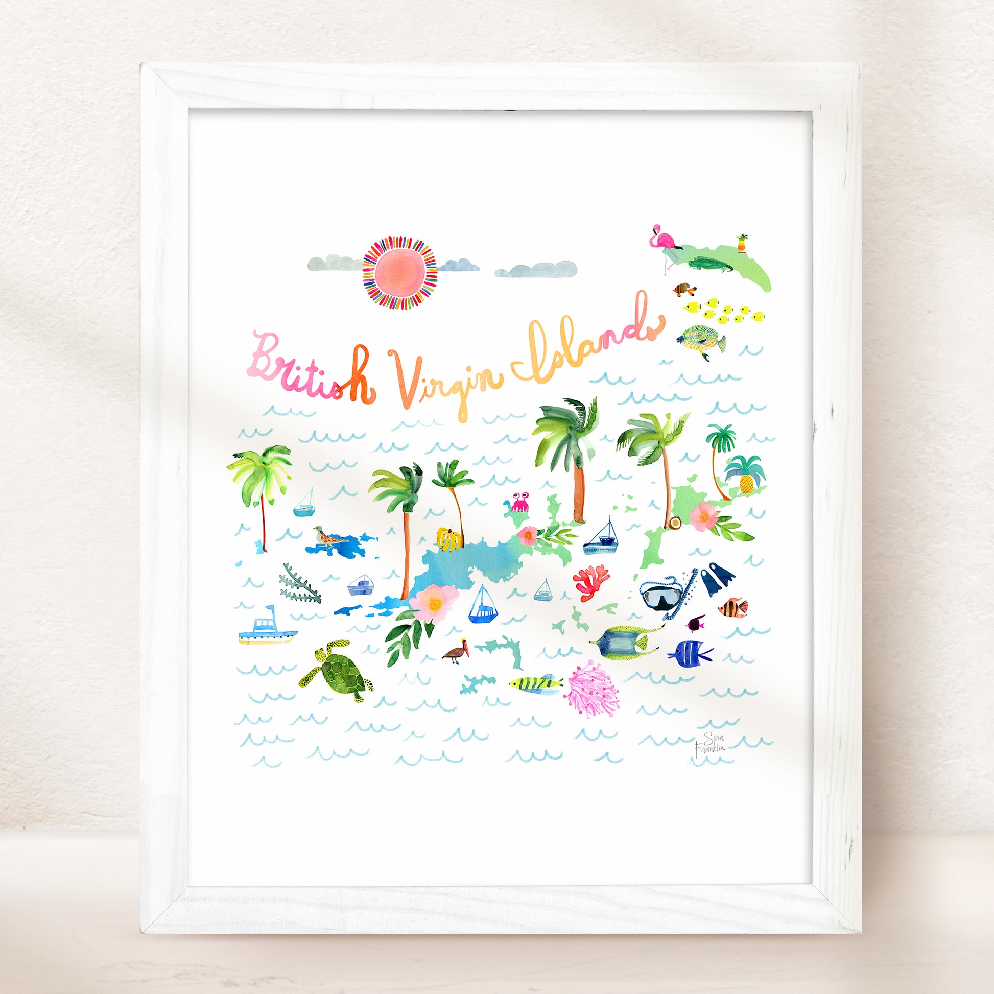 a white framed picture of a beach scene
