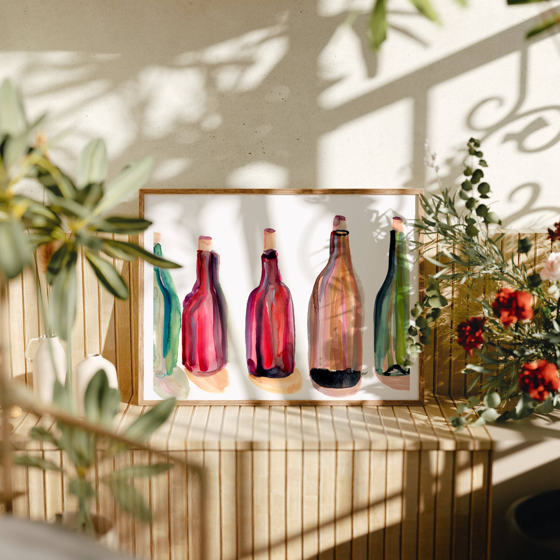 a painting of five colorful wine bottles arranged in a row on a wooden surface, with a plant and flowers in the background.