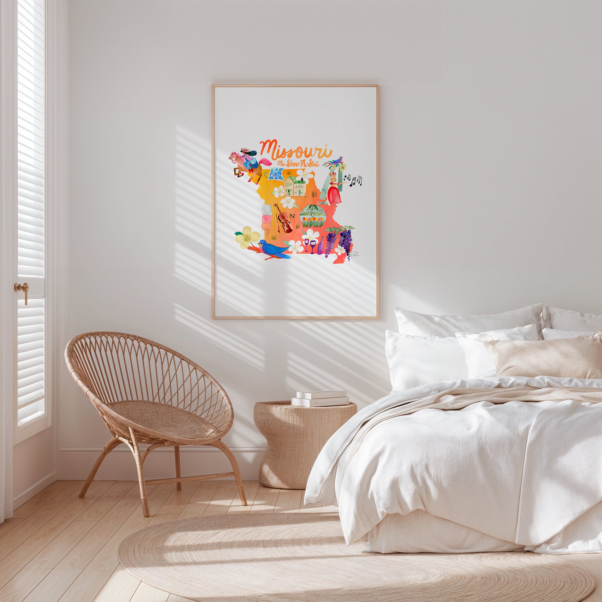 a white bedroom with a poster on the wall
