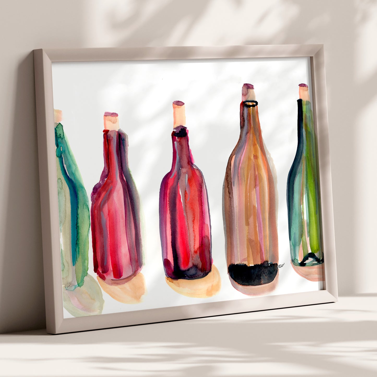 The image is a framed watercolor painting of five colorful wine bottles, each with a unique design and color.