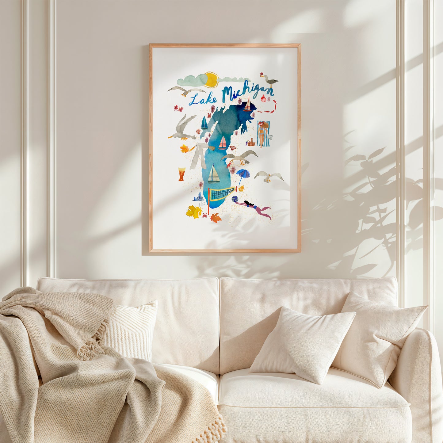 a living room with a white couch and a painting on the wall