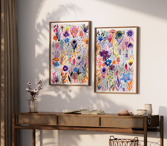 two paintings on a wall above a table