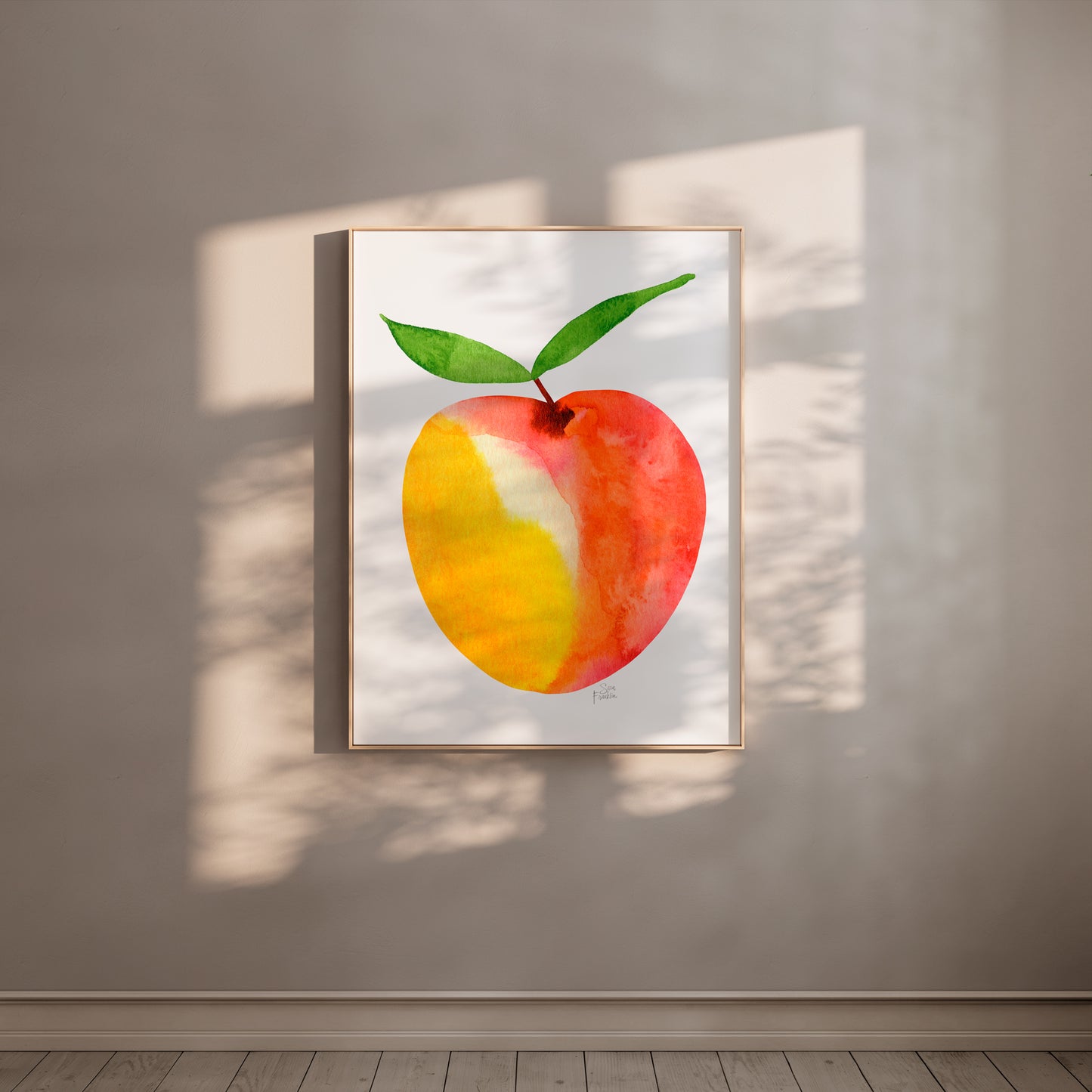 a framed painting of a peach hanging on a wall.