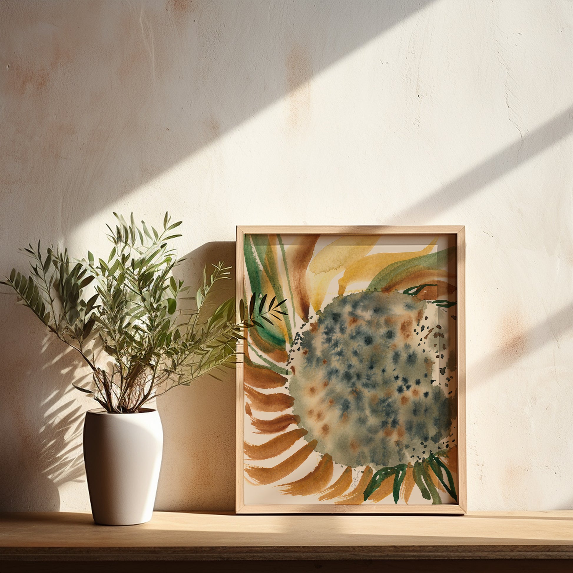 a white vase with a plant on a wooden shelf, accompanied by a framed painting of a sunflower.