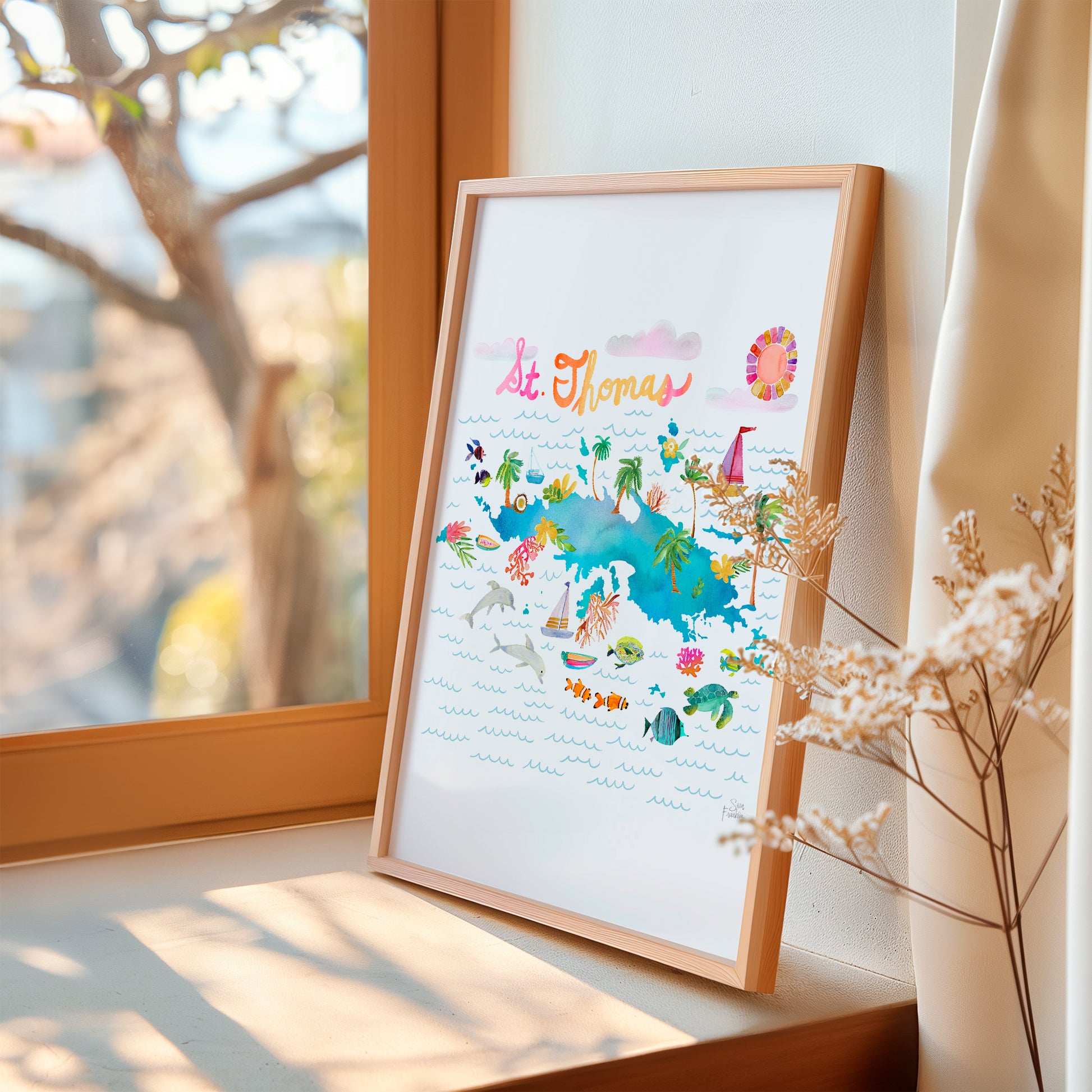 a picture frame sitting on a window sill next to a window