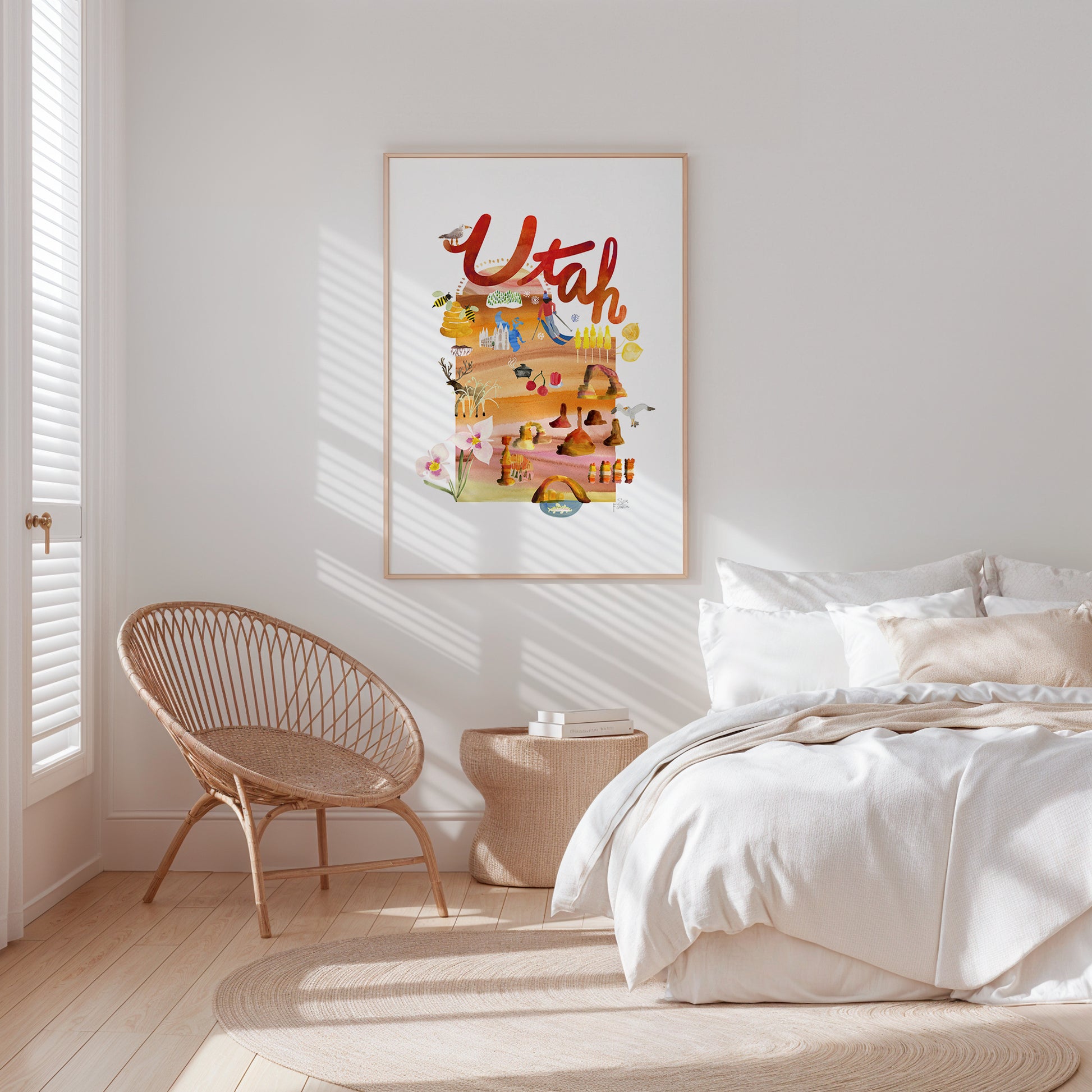 a bedroom with a white bed and a white chair