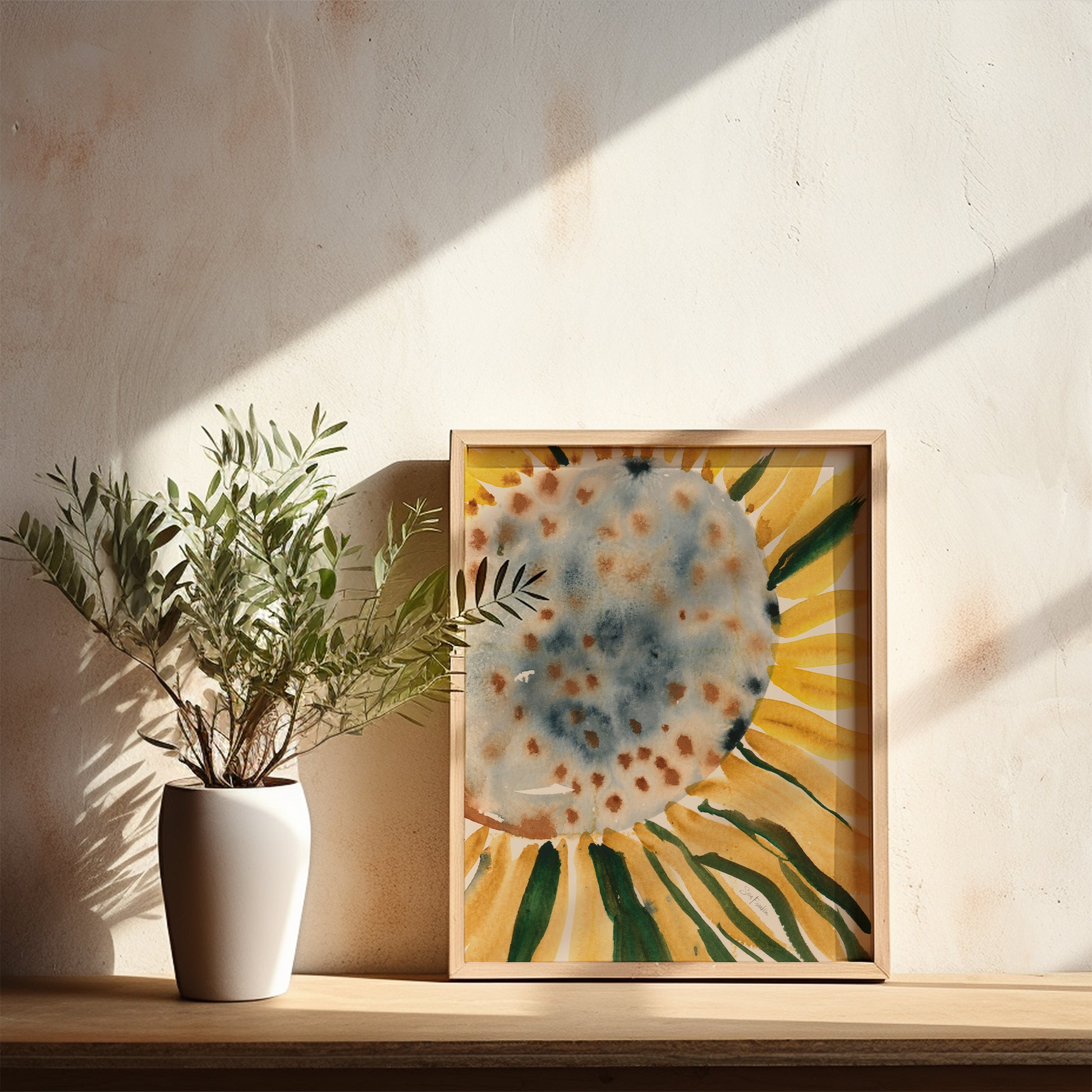 a white vase with a plant on a wooden shelf, accompanied by a framed painting of a sunflower.