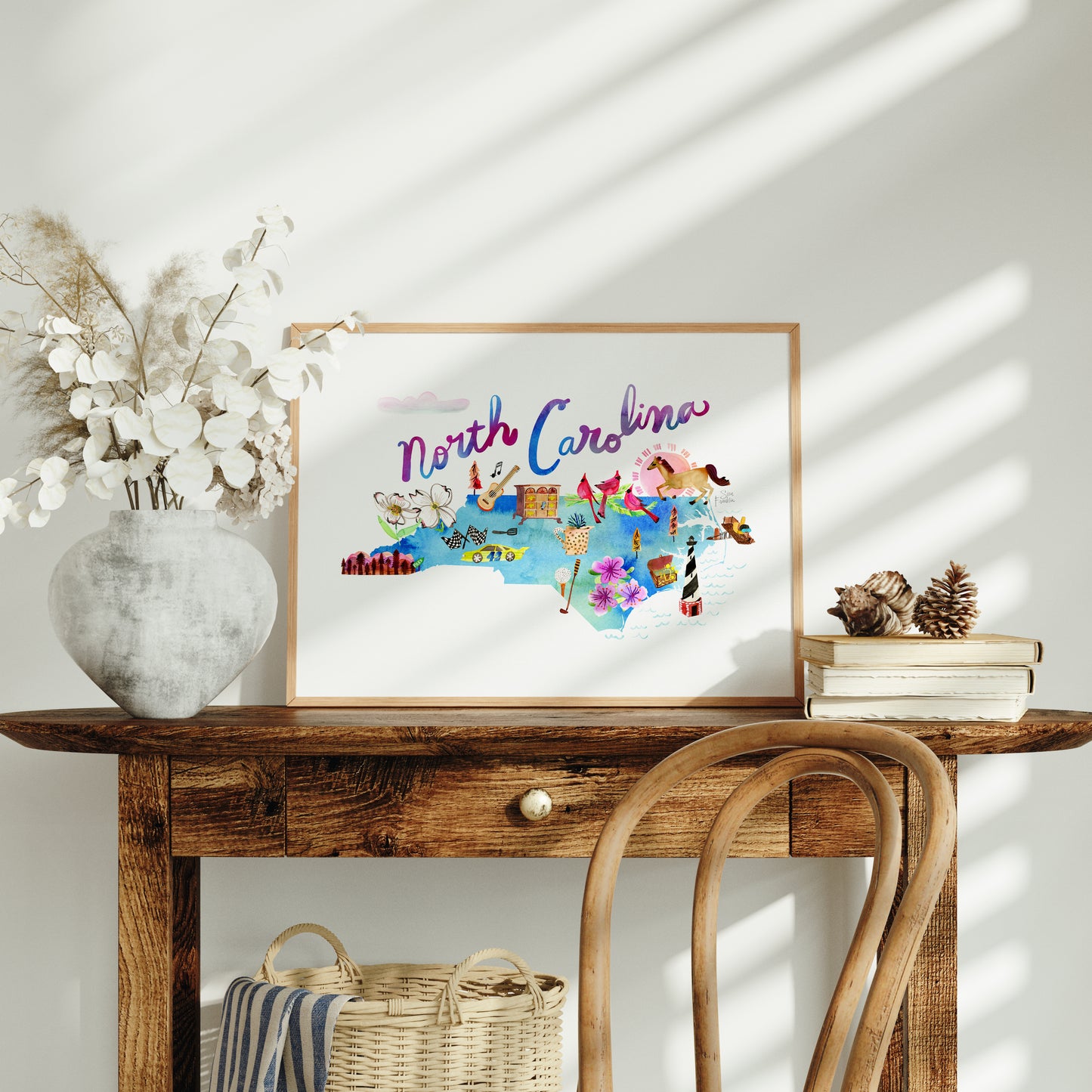 a wooden table with a vase of flowers on top of it